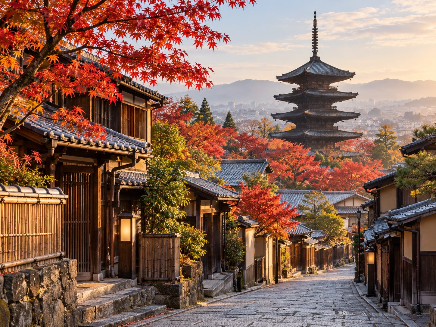 Kyoto pagoda framed by autumn maple leaves
